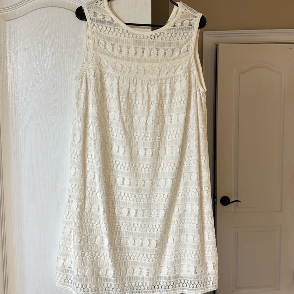 White cut out lace midi dress. Hits at knees